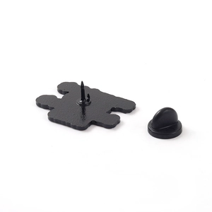 Minimalist black lacquer enamel pin showing the back needle and black rubber clutch back