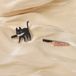 Funny black cat holding knife enamel pin set with Killing It text on gold silk