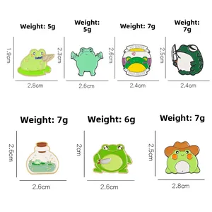 Collection of various cartoon frog enamel pins with diverse poses and sizes