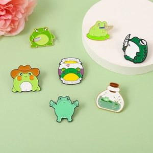 7-piece set of cartoon frog enamel pins with cowboy and humorous knife designs