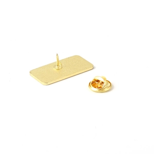 Golden alloy butterfly clutch pin back set with rectangular metal base on white background