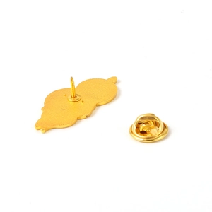 Macro view of bright gold plated metal butterfly clutch pin and backing for brooches