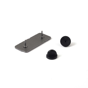 Rectangle alloy brooch pins with double back rubber clutches on a plain white surface