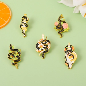 Dark aesthetic snake and sword enamel brooch pin collection with floral metal badge details