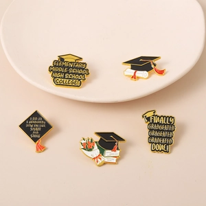 5-piece graduation enamel pin set with mortarboard and book designs in gold finish