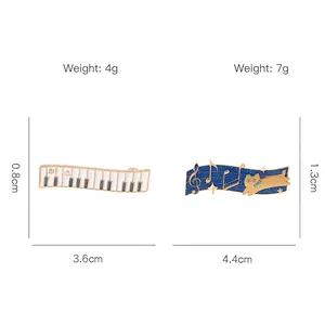 Music themed enamel pins featuring piano keys and cat sheet music designs with dimensions