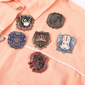 Academic style enamel brooch set with swan and crown designs on pink denim jacket