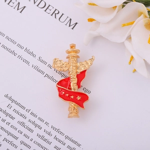 Golden Chinese Huabiao pillar brooch with red enamel ribbon and five gold stars