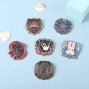 Detailed macro view of six distinct enamel pins featuring fantasy crown and swan crest designs