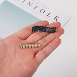 Exquisite enamel music pins set featuring a piano keyboard and a starry sky cat with notes