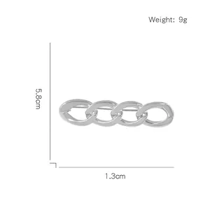 Minimalist silver metal chain brooch accessory with four interlocking rings in 5.8cm length