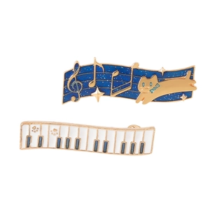 Musical cat brooch set with starry sky sheet music and piano keys in gold plating