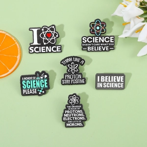 Detailed view of six unique black science enamel pins featuring atom and flask designs