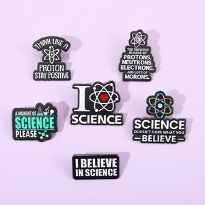 Set of six enamel science badges featuring atoms and humorus quotes on metal pins