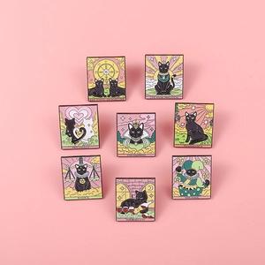 Set of eight enamel tarot pins featuring black cats in various mystical card designs