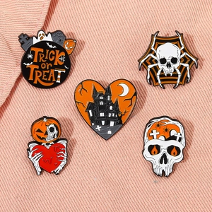 5-piece Halloween enamel pin set featuring pumpkin, skull and trick or treat motifs