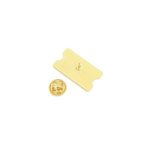 Golden ticket-shaped metal brooch back detail with butterfly clutch on white background