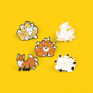 Set of five cute Nine-Tailed Fox enamel lapel pins in various poses on yellow background