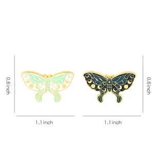 Cartoon insect butterfly enamel pin in green colors with moon and star patterns