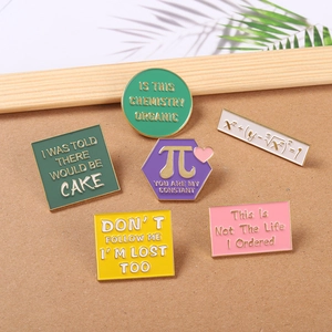Set of six colorful enamel pins featuring math formulas and geometry for clothing decor