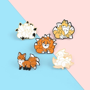 Detailed set of five creative cartoon nine-tailed fox enamel pins in various poses