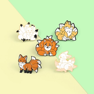 Detailed view of nine-tailed fox enamel pin set in various cute cartoon poses and colors
