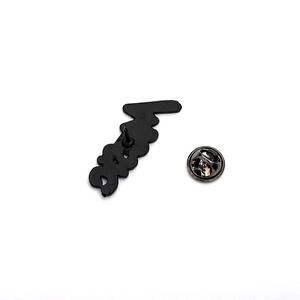 Black enamel music brooch back view with butterfly clasp and engraved metal pin