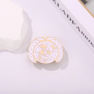 Detail of United Nations UN logo pin with gold metal edging and white enamel finish