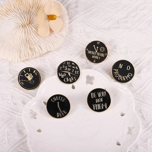 Set of 6 black round enamel pins with gold trim and motivational quotes for jackets