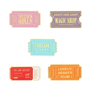 Five vintage enamel ticket pins set in pastel colors with gold embossed lettering