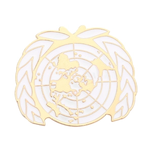 Golden United Nations enamel pin with olive wreath and world map design