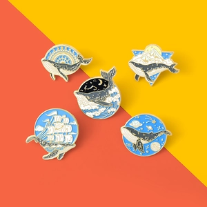 5-piece set of cartoon whale enamel pins with waves mountains and starry sky designs