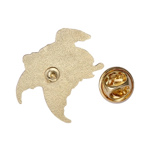 Golden alloy animal brooch back view showing metal butterfly clutch and matte texture