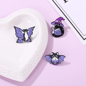 Three-piece set of purple wizard black cat enamel pins featuring wings and magic books