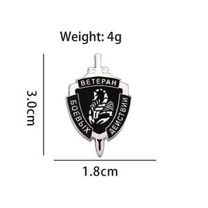 Silver combat veteran shield pin with black enamel scorpion and Russian engraving