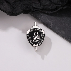 Punk style shield brooch with black scorpion and sword motif in silver finish