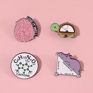Set of four creative science and math enamel pins featuring an owl, turtle, and brain shapes