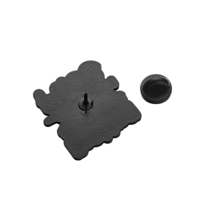Back view of black enamel pin with metal stud and matching rubber clutch on white background