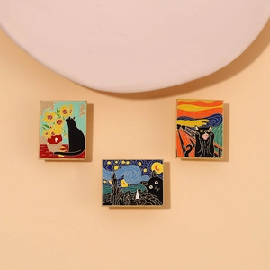 Close-up of artistic black cat enamel pins featuring oil painting styles on a beige display