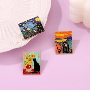 Detailed view of black cat enamel pins inspired by Van Gogh and Munch art on a ceramic plate