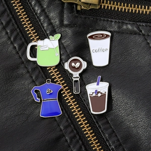 Five-piece coffee and tea enamel pin set displayed on a stylish black leather jacket background
