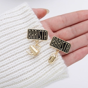 Barista enamel brooch pins with coffee pot and bean charms on white knit sweater