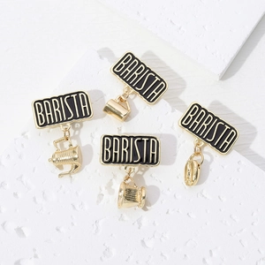Barista enamel brooch set with gold coffee pot bean charms on white stone texture