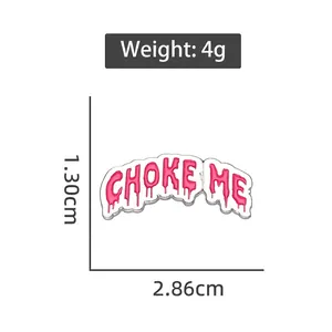 Pink enamel Choke Me letter brooch pin in alloy metal with dripping text design