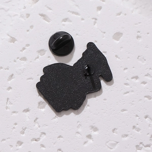Macro shot of the black metal lapel pin back featuring a durable black rubber clutch