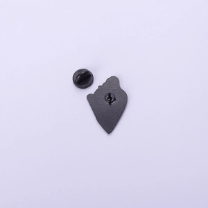 Back view of cute frog alloy badge with black textured plating and rubber clutch