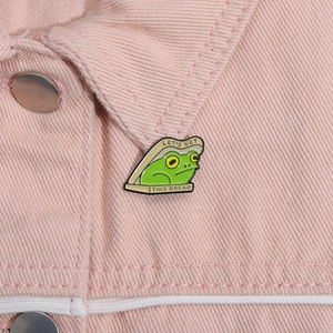 Funny green frog in bread enamel pin with Let's Get This Bread text on pink jacket
