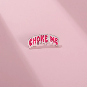 Pink enamel pin with CHOKE ME dripping letter design and silver metal outline