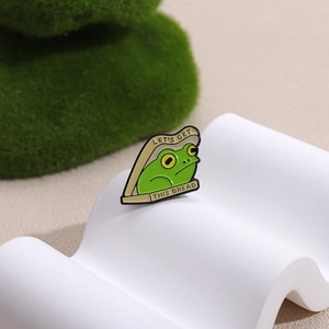 Funny green frog toast bread enamel pin featuring Let's Get This Bread text
