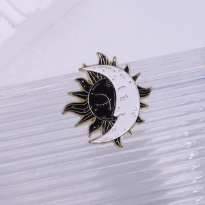 Vintage sun and moon enamel brooch with black and white celestial design for bags
